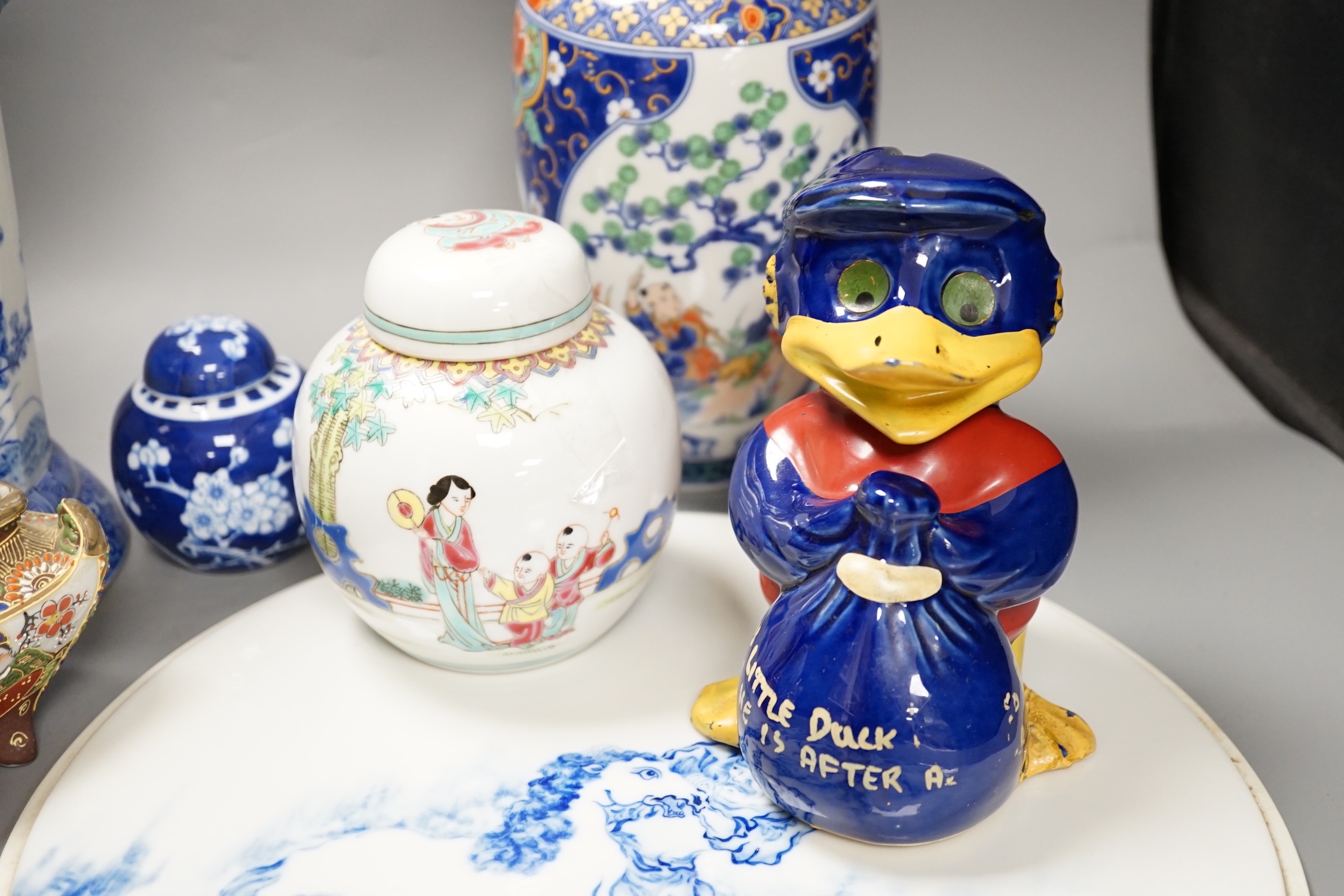 A group of 20th century Chinese and Japanese ceramics, including a blue and white circular plaque, 31 cm diameter